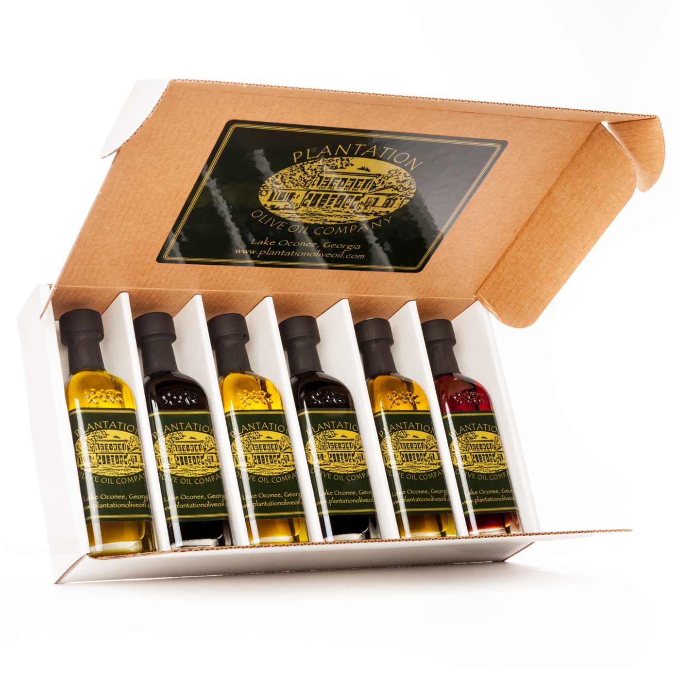 The open white box with six miniature sample olive oil and balsamic vinegar bottles is displayed on a white background.