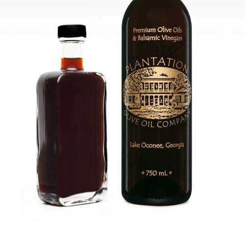 Photo showing Vermont maple to the left of large Plantation vinegar bottle.