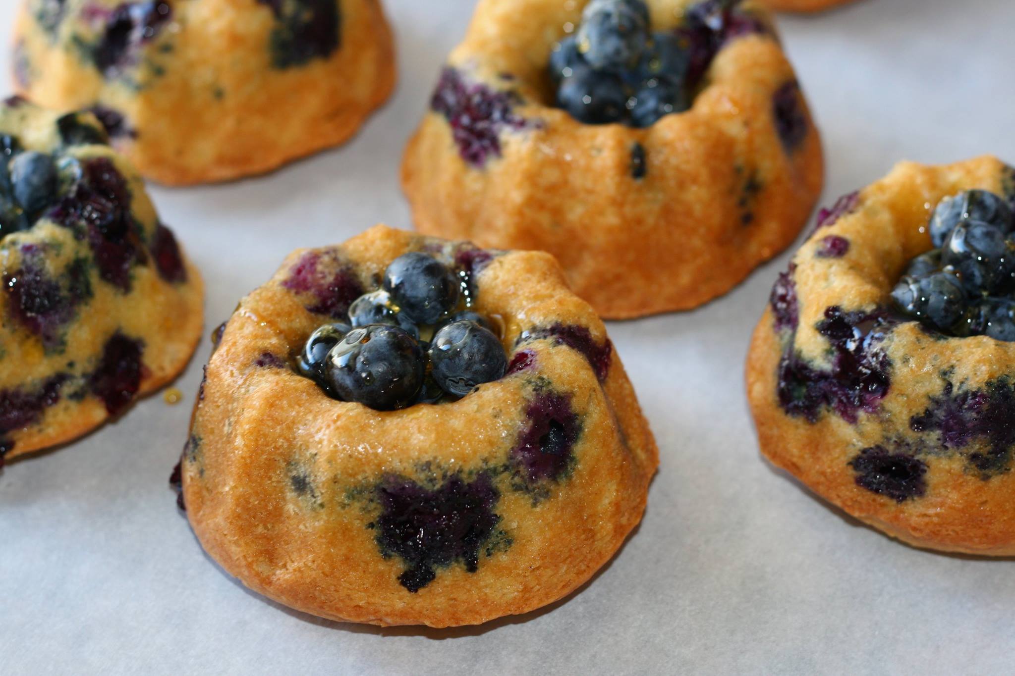 Blueberry bundt cakes made with sour cream and olive oil.